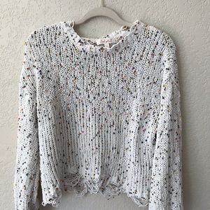 Distressed sweater with rainbow accents!